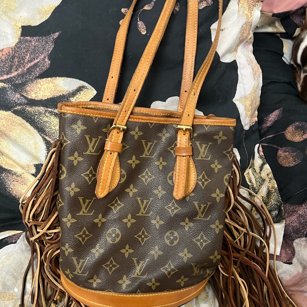 Refurbished Louis Vuitton Tote with leather fringe and bead accents.